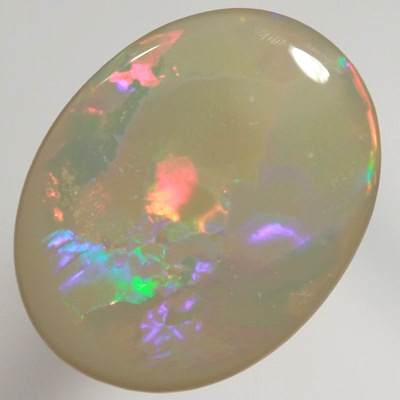 SOLID SEMI BLACK OPAL  Very bright fire in a Flag Harlequin pattern. SEE VIDEO